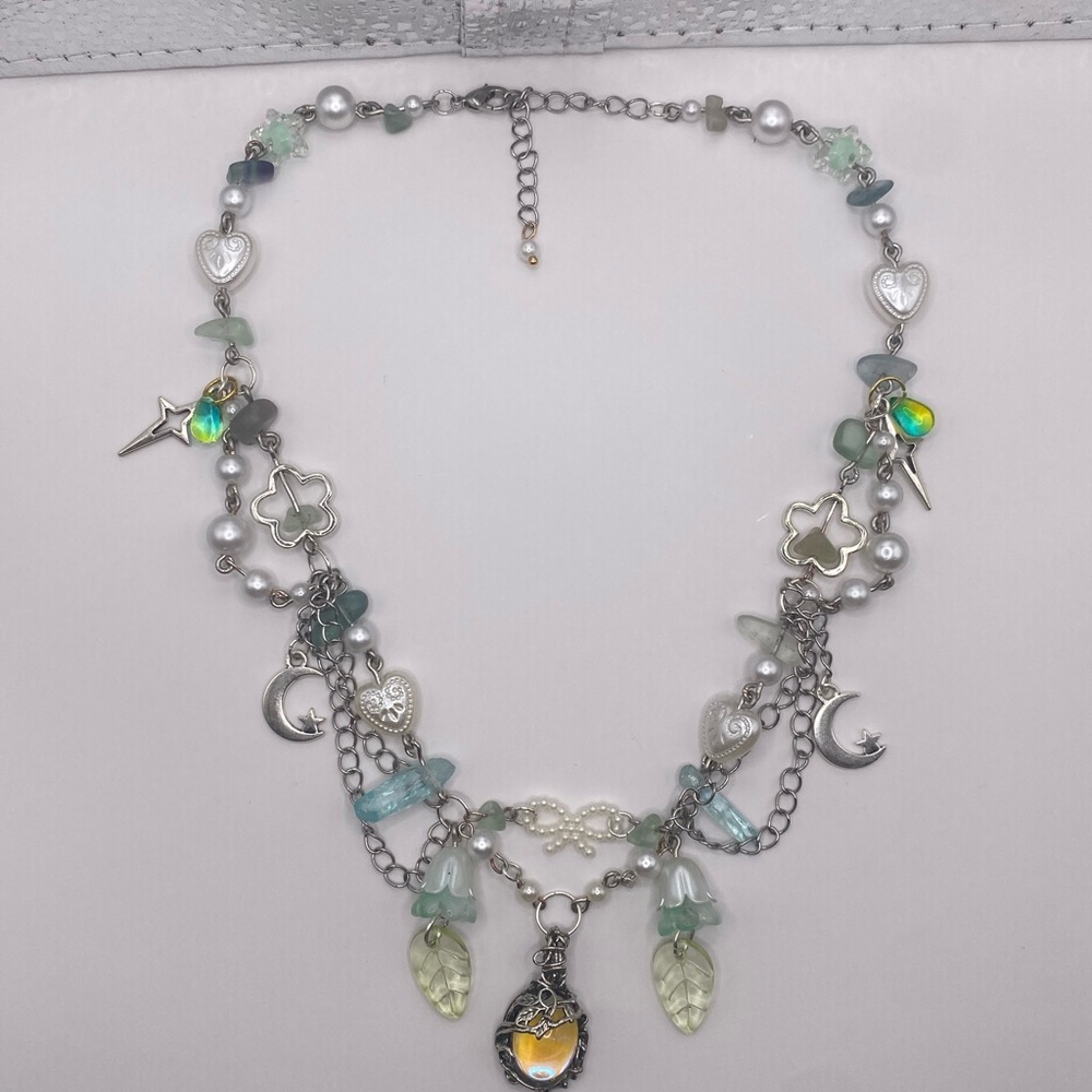 Charming Silver and Green Necklace with Star and Heart Accents